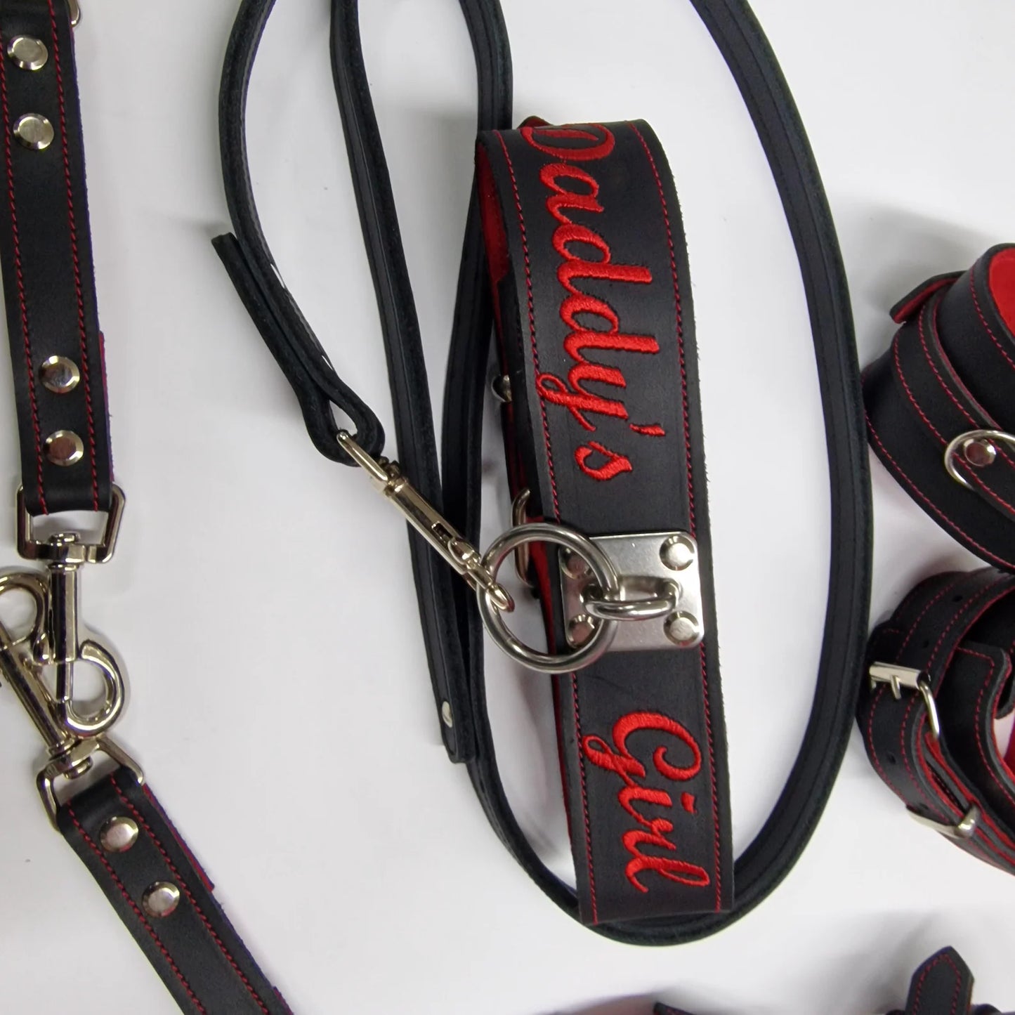 BDSM set in black leather and suede linning, custom text on choker